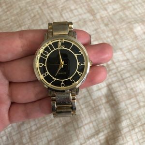Charming Charlie’s gold watch with black face